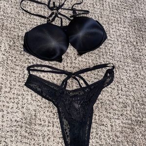 Front close satin black bombshell with gold detail